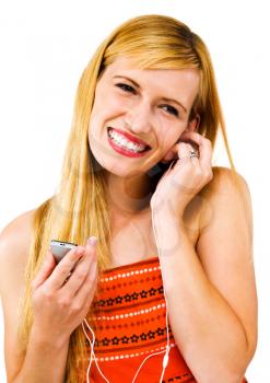 Royalty Free Photo of a Woman Listening to an Mp3 Player