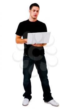 Royalty Free Photo of a Man Standing and Holding a Laptop