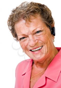 Royalty Free Photo of a Mature Woman Wearing a Bluetooth