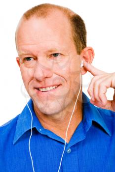 Royalty Free Photo of a Man Listening to Music on his Mp3 Player