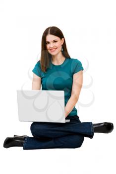 Royalty Free Photo of a Woman Sitting on the Floor Using a Laptop