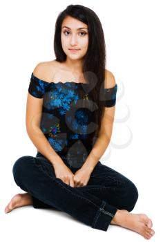 Royalty Free Photo of a Young Woman Sitting Down on the Floor
