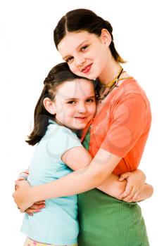 Royalty Free Photo of a Two Young Girls Hugging