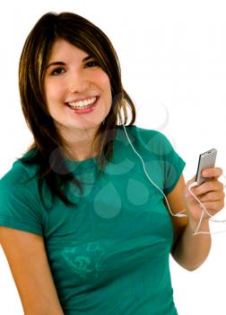 Portrait of a woman listening to music on a MP3 player isolated over white