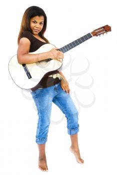 Girl playing a guitar isolated over white
