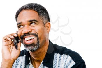Smiling man talking on a mobile phone isolated over white