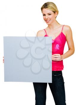 Mid adult woman holding a placard and smiling isolated over white