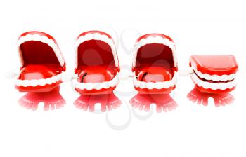 Four sets of dentures isolated over white