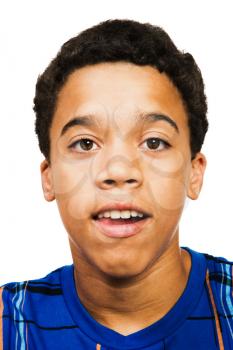 Mixed race teenage boy posing isolated over white