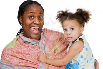 Smiling woman carrying her daughter isolated over white