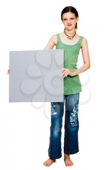 Child showing a placard and smiling isolated over white