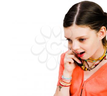 Close-up of a girl talking on a mobile phone isolated over white