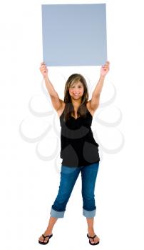 Woman showing a blank placard and smiling isolated over white