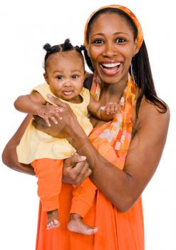 Portrait of a woman carrying her daughter and smiling isolated over white