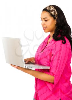 Hispanic young woman using a laptop isolated over white