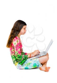 Beautiful girl working on a laptop isolated over white