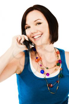 Portrait of a woman talking on a mobile phone isolated over white