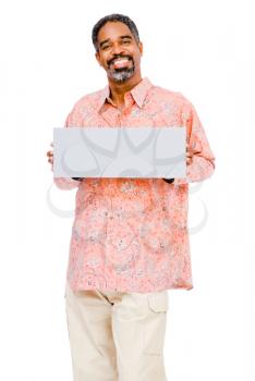 Close-up of a mature man showing a placard isolated over white