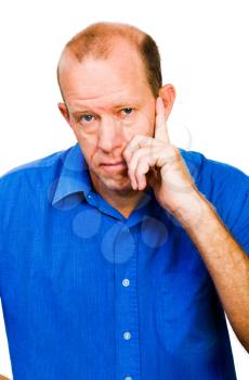 Close-up of a mature man thinking isolated over white