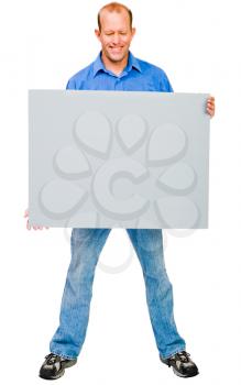 Happy mature man showing a placard isolated over white