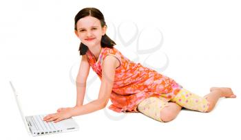 Portrait of a girl using a laptop and posing isolated over white