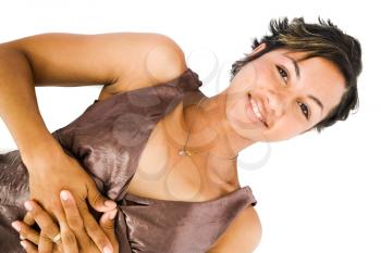 Mixed race young woman lying and smiling isolated over white