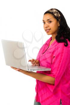 Beautiful young woman using a laptop isolated over white