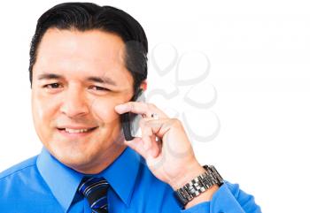 Smiling businessman talking on a mobile phone isolated over white
