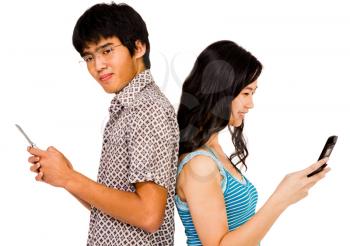 Confident couple text messaging on mobile phones isolated over white