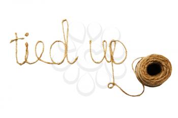 Tied up text written with a spool of twine isolated over white