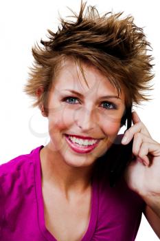 Gorgeous woman talking on a mobile phone isolated over white