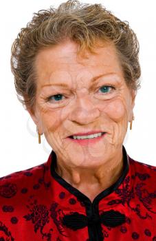 Portrait of a senior woman smiling isolated over white