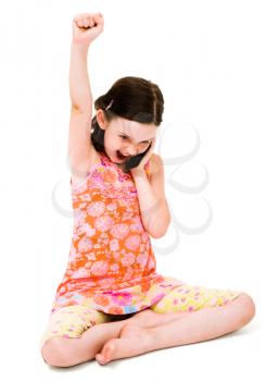 Cheerful girl talking on a mobile phone isolated over white