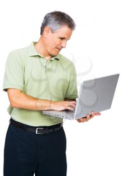 Man working on a laptop isolated over white