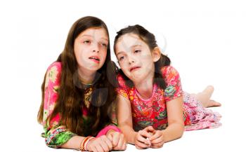 Two girls making face isolated over white