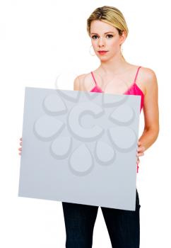 Mid adult woman holding a placard and posing isolated over white