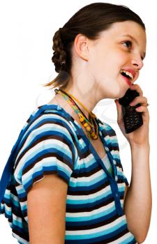 Close-up of a girl talking on a mobile phone isolated over white