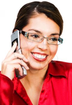Mid adult woman talking on a mobile phone isolated over white