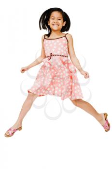 Close-up of a girl jumping and smiling isolated over white