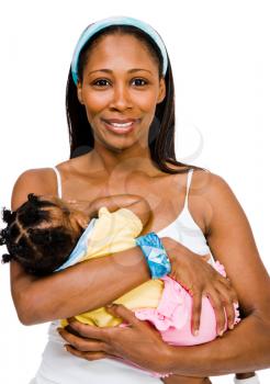 Happy woman carrying her daughter and posing isolated over white
