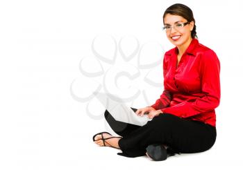 Confident woman using a laptop and smiling isolated over white