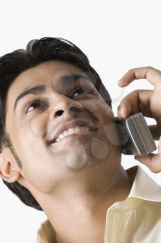 Close-up of a man talking on a mobile phone