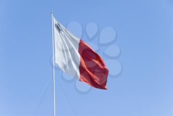 Low angle view of a Maltese Flag, Valletta, Malta