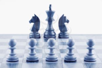 Close-up of chess pieces on a chessboard