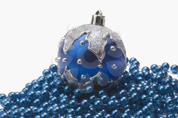 Blue bauble on string of blue beads