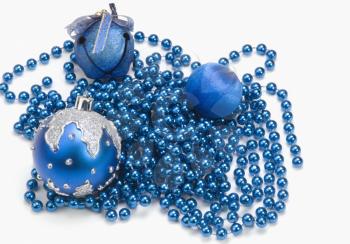 Three blue Christmas ornaments on string of blue beads