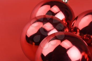 Close-up of four red baubles