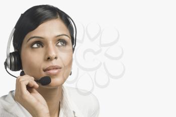 Close-up of a female customer service representative thinking