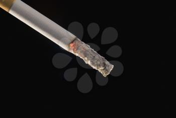 Close-up of a cigarette with ash