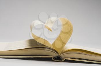 Pages of a book making a heart shape